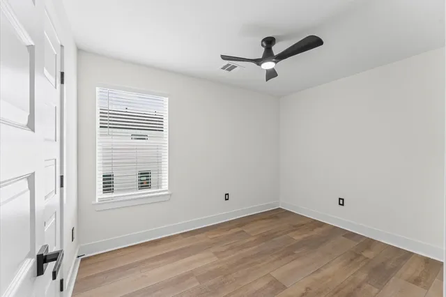 a bathroom with a sink toilet vanity and tub