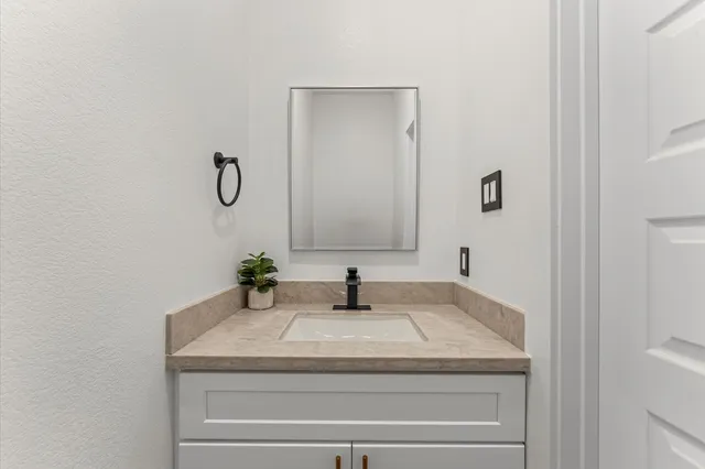 front view of a house with a garden