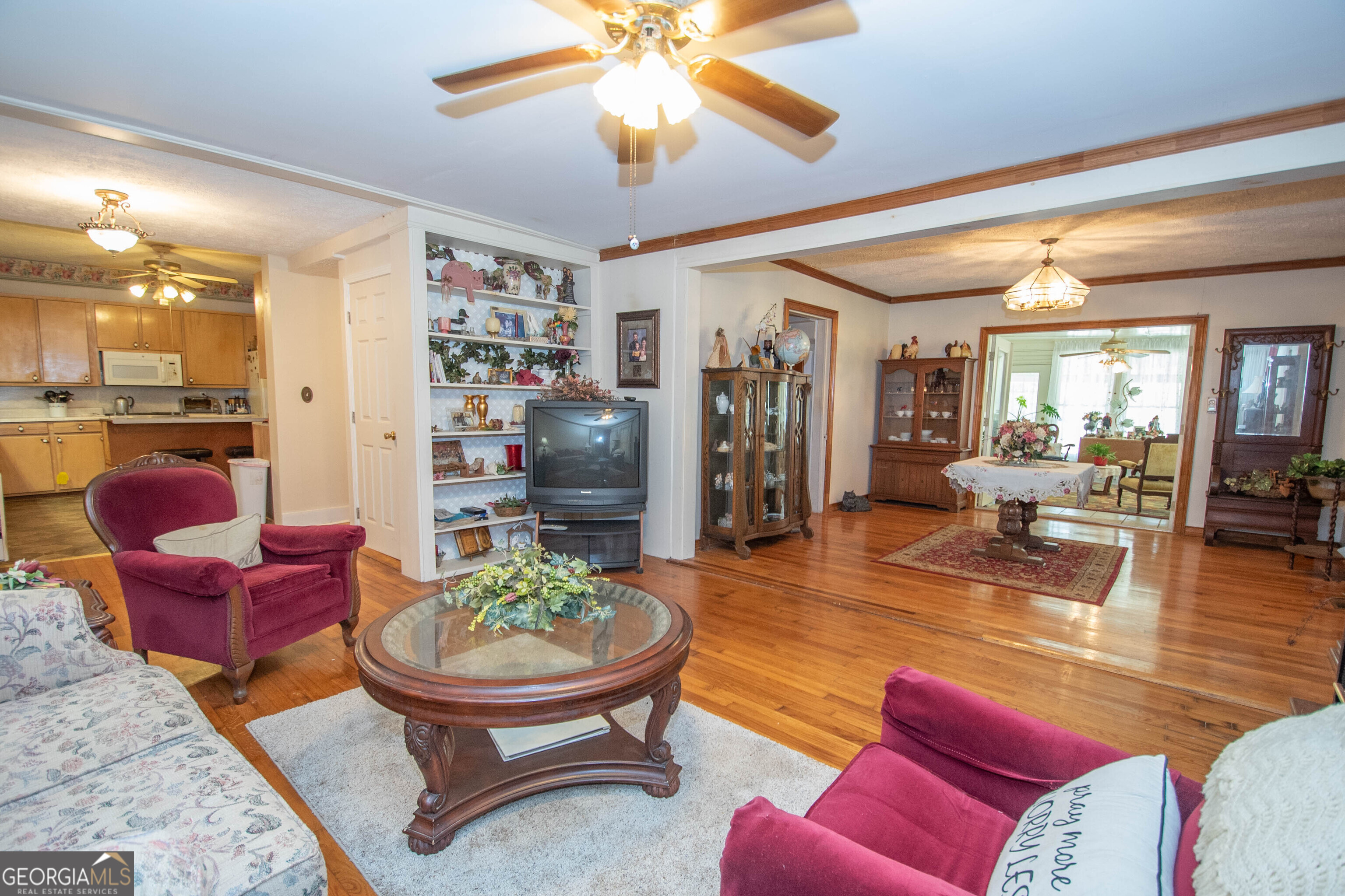 125 Fowler Street Warm Springs, GA 31830 - Photo 11 of 46 a living room with furniture a rug and a chandelier