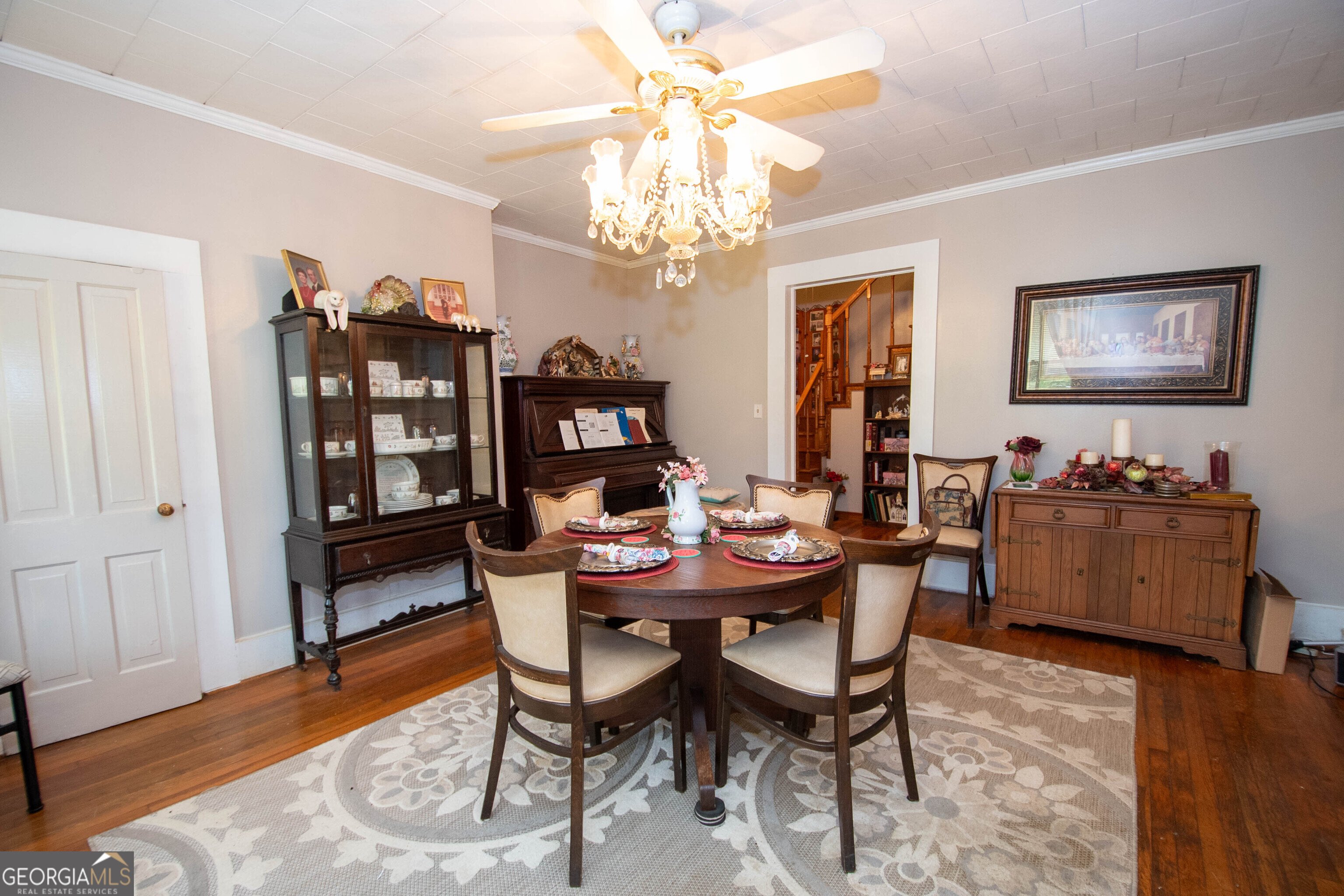 125 Fowler Street Warm Springs, GA 31830 - Photo 13 of 46 a view of a dining room with furniture and wooden floor