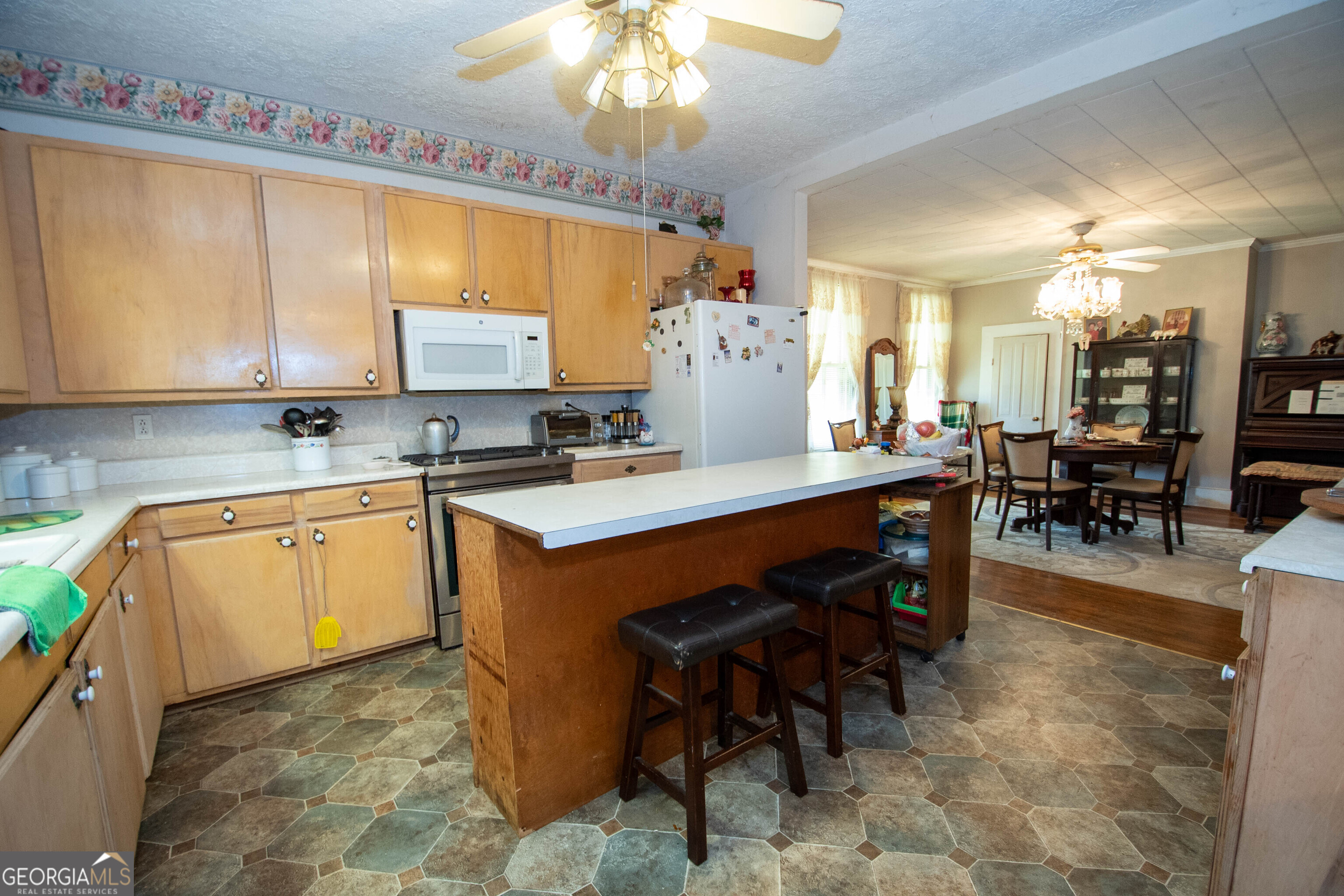 125 Fowler Street Warm Springs, GA 31830 - Photo 15 of 46 a kitchen with a sink stove and cabinets