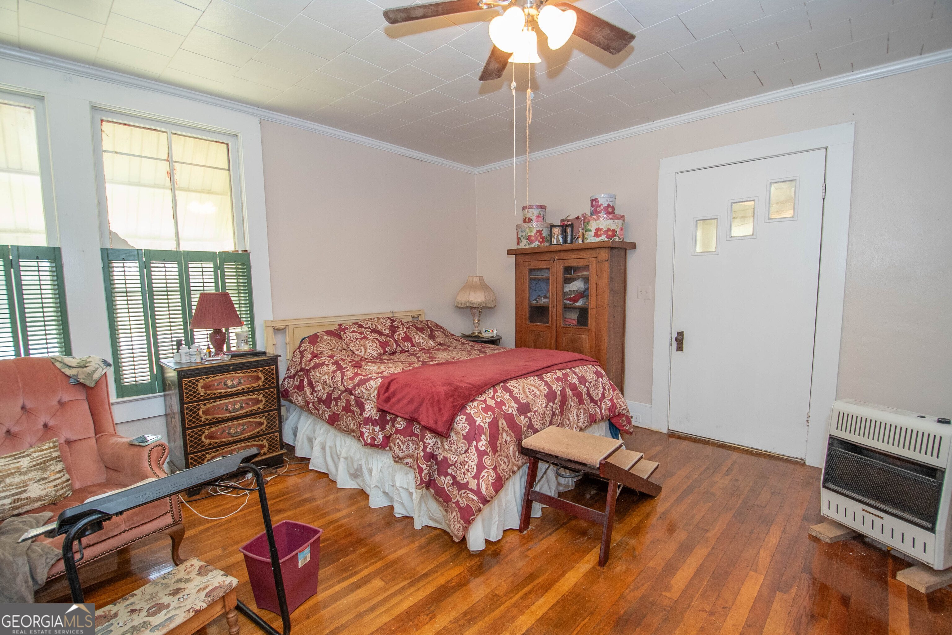 125 Fowler Street Warm Springs, GA 31830 - Photo 18 of 46 a bedroom with a bed and wooden floor