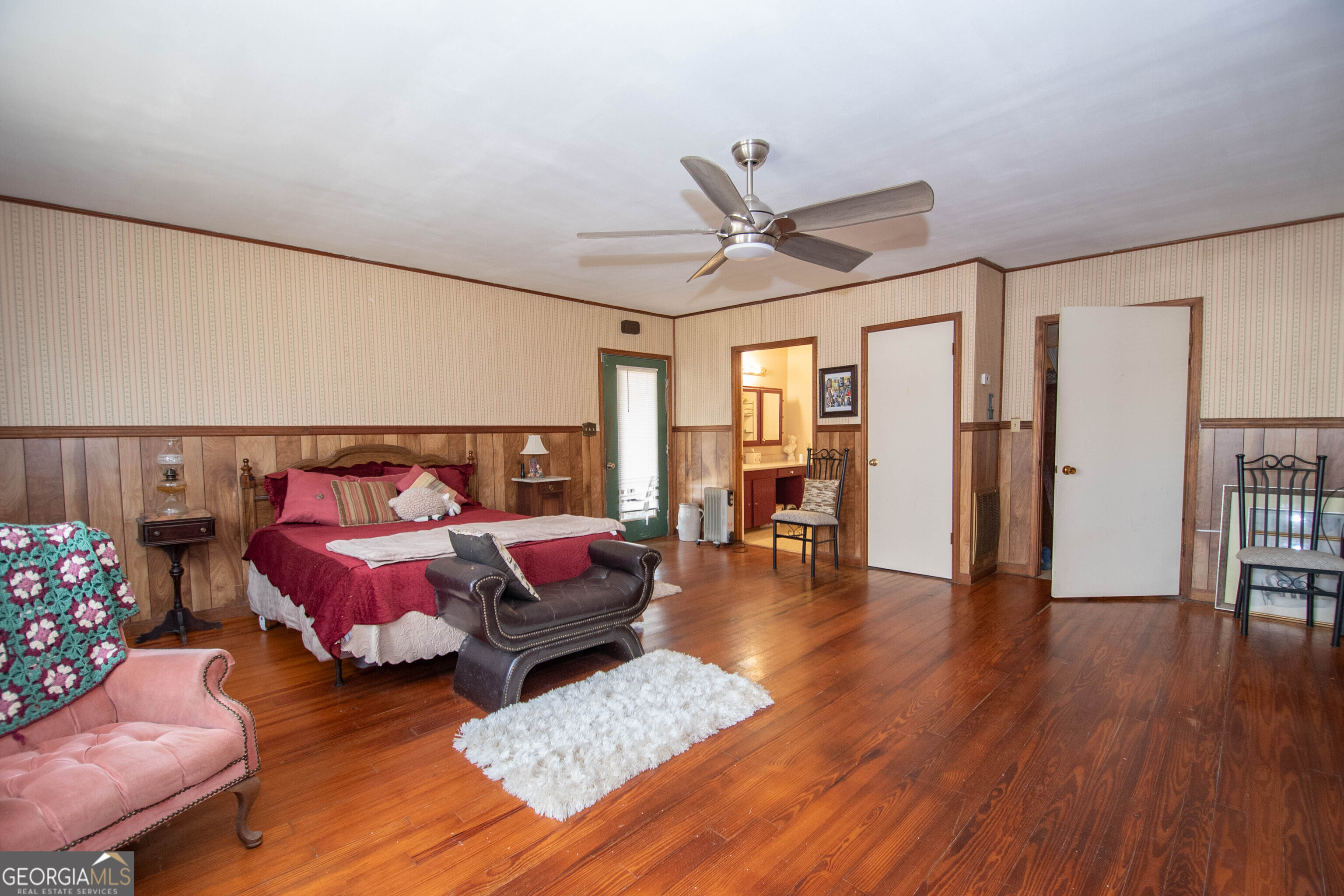 125 Fowler Street Warm Springs, GA 31830 - Photo 22 of 46 a bedroom with furniture and wooden floor