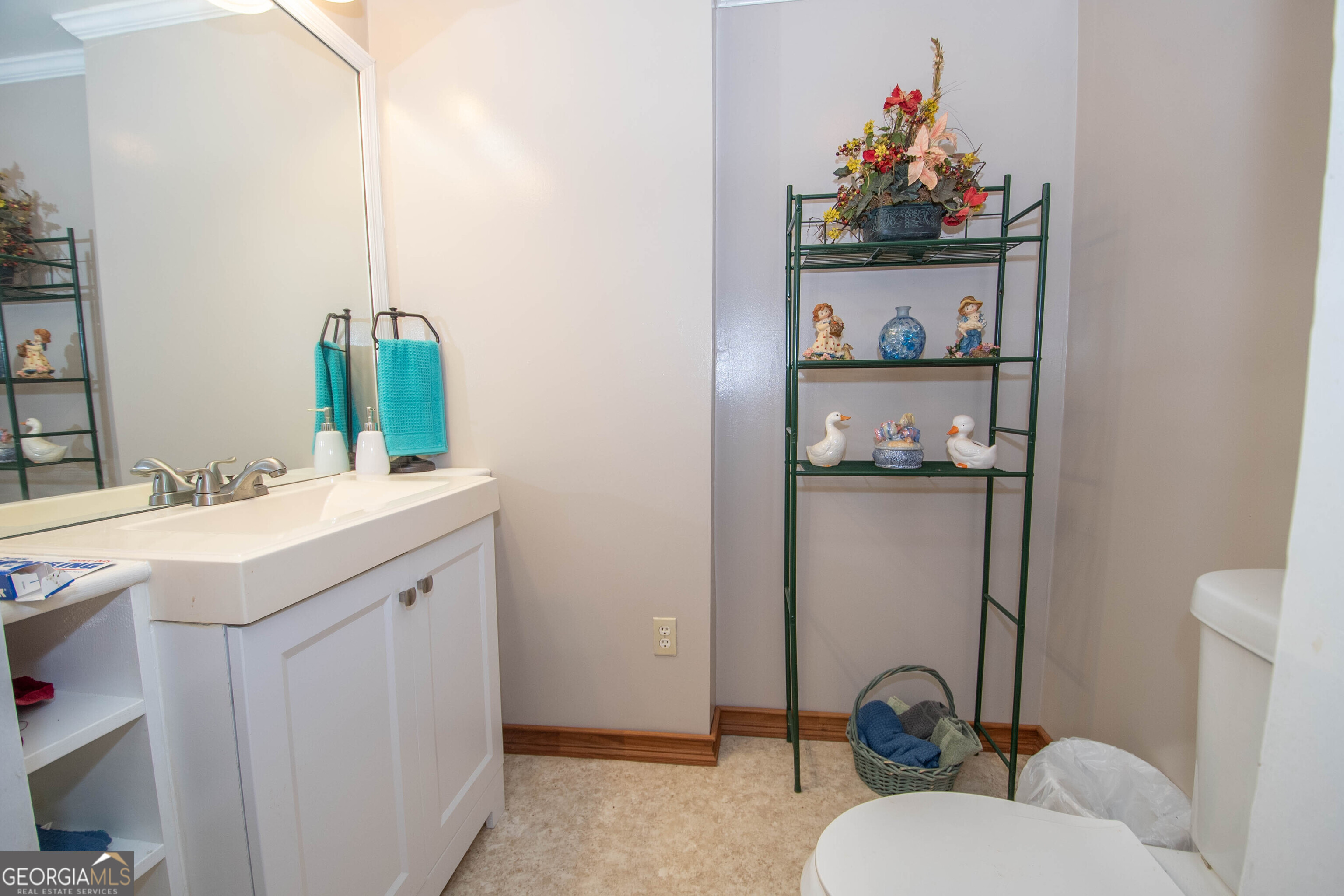 125 Fowler Street Warm Springs, GA 31830 - Photo 23 of 46 a bathroom with a sink and a mirror