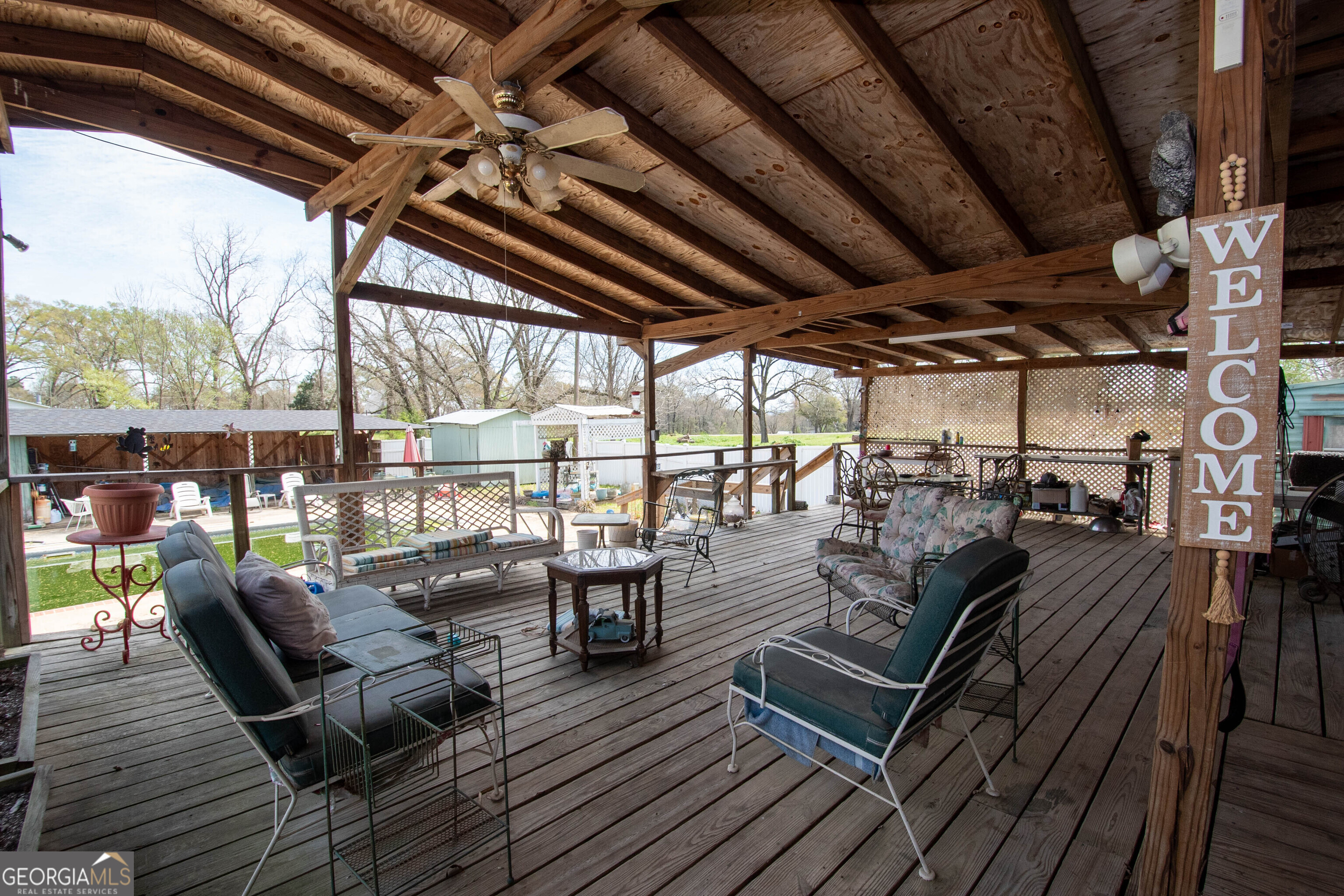 125 Fowler Street Warm Springs, GA 31830 - Photo 31 of 46 a view of a patio with couches and chairs with wooden floor