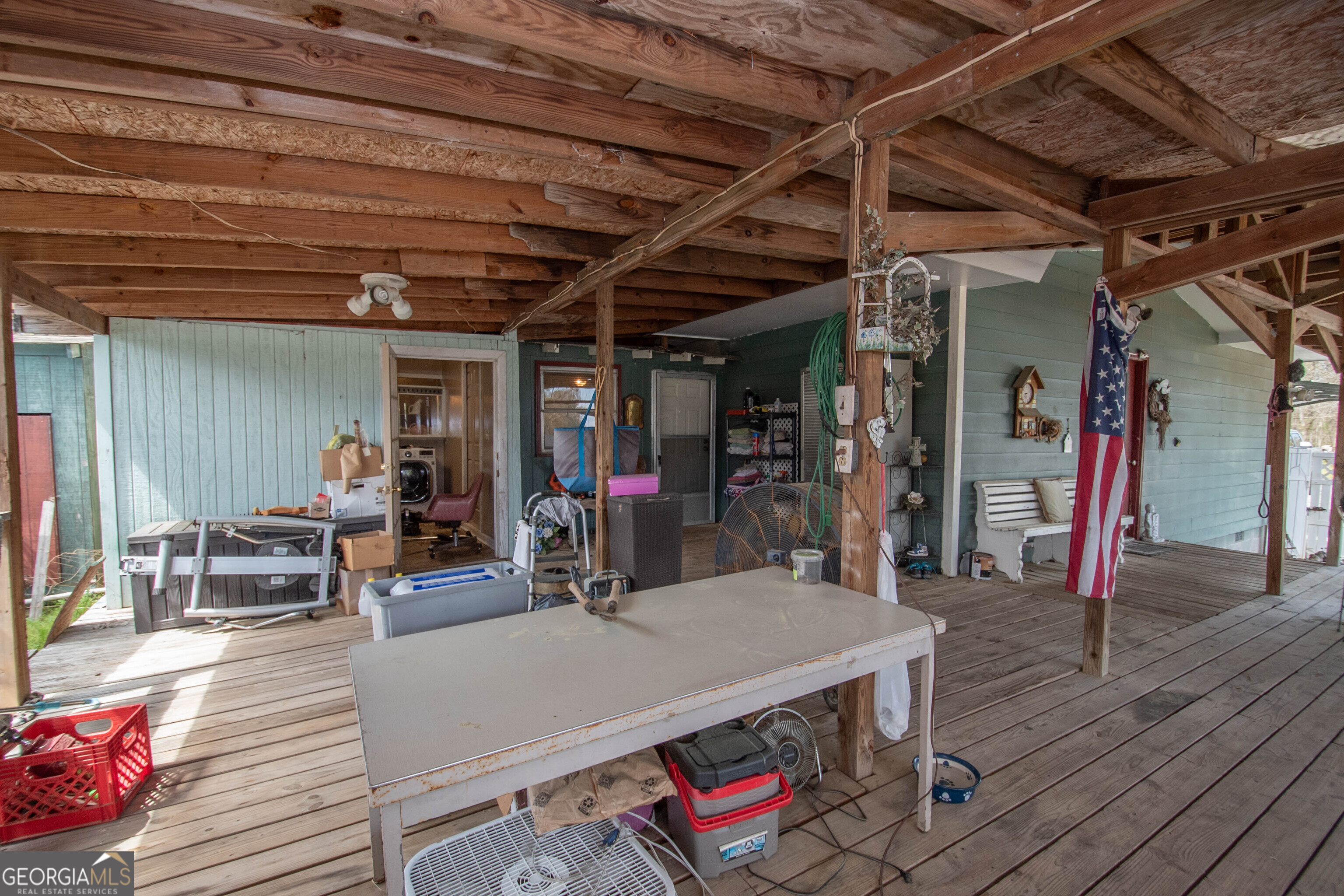 125 Fowler Street Warm Springs, GA 31830 - Photo 34 of 46 a view of a dining room with furniture wooden floor and a chandelier