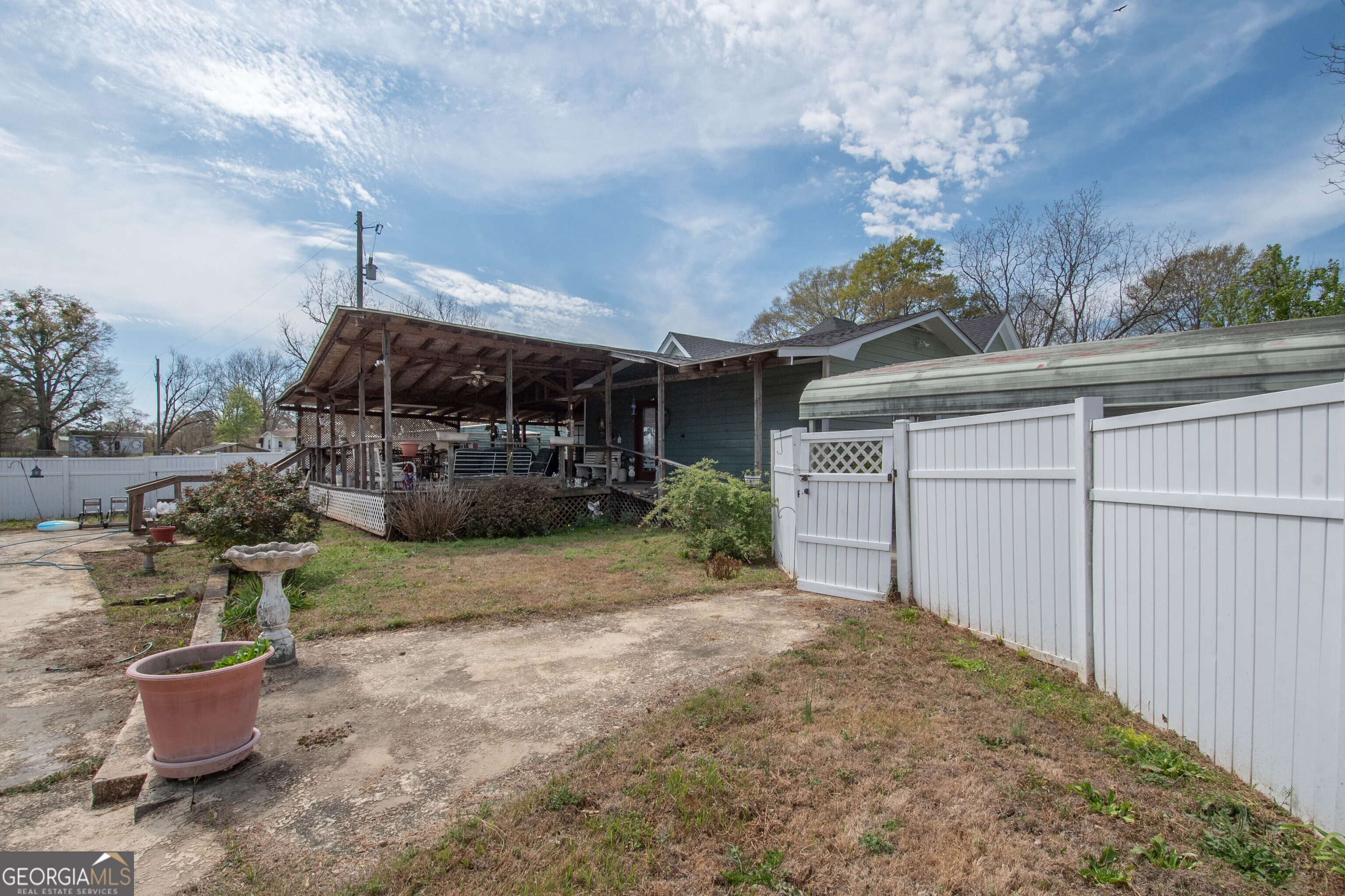 125 Fowler Street Warm Springs, GA 31830 - Photo 38 of 46 a view of a patio with couches and potted plants