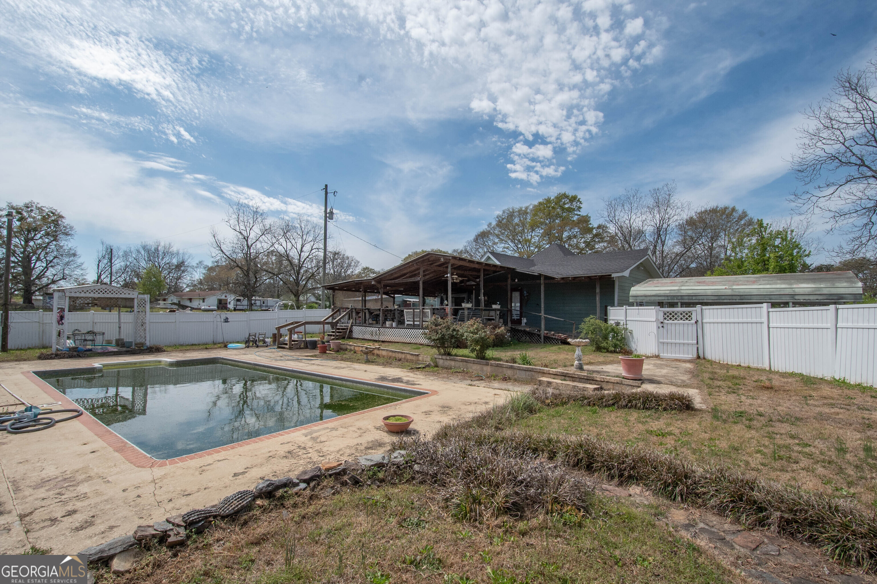 125 Fowler Street Warm Springs, GA 31830 - Photo 39 of 46 a view of a house with swimming pool and sitting area