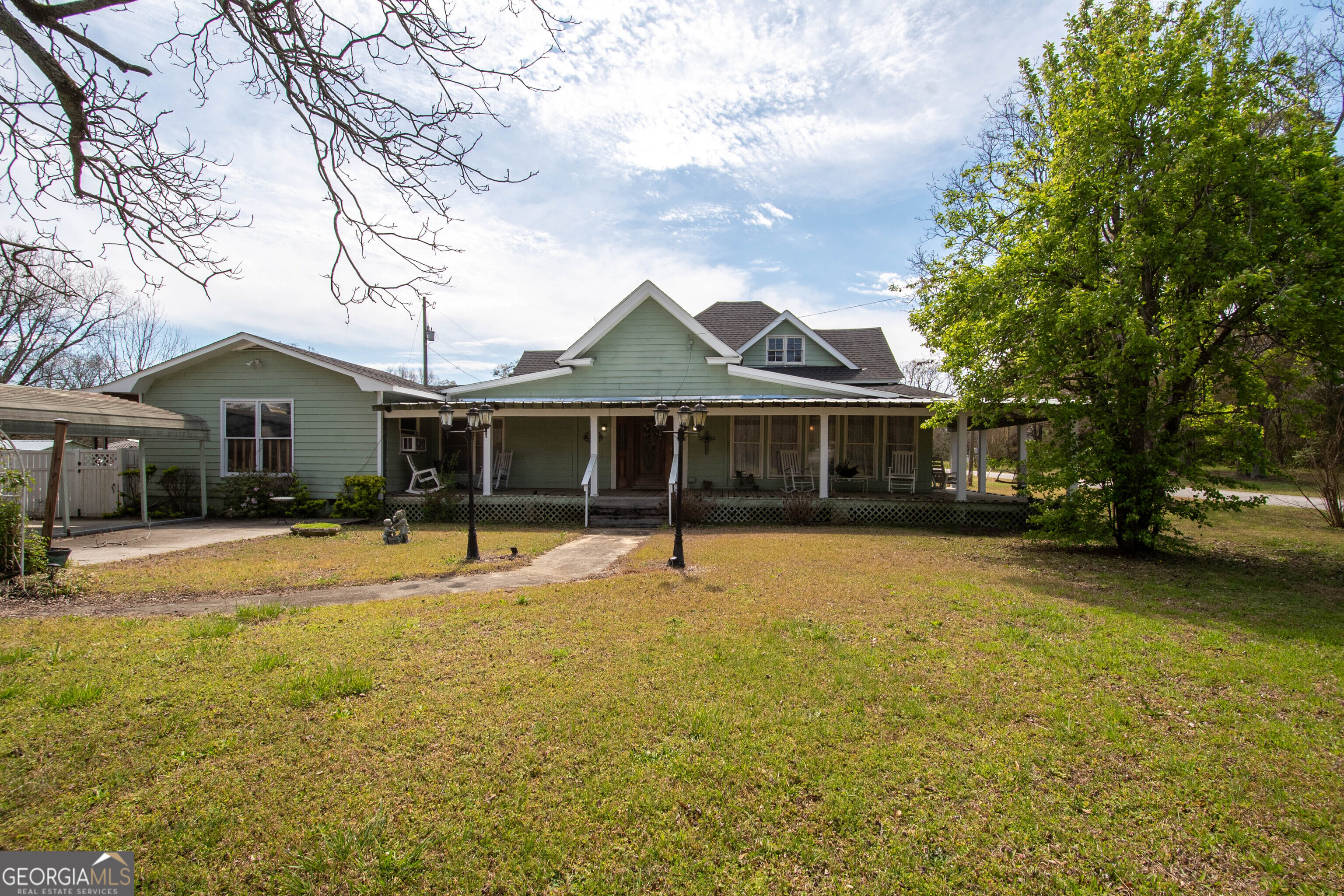 125 Fowler Street Warm Springs, GA 31830 - Photo 4 of 46 a front view of a house with a garden