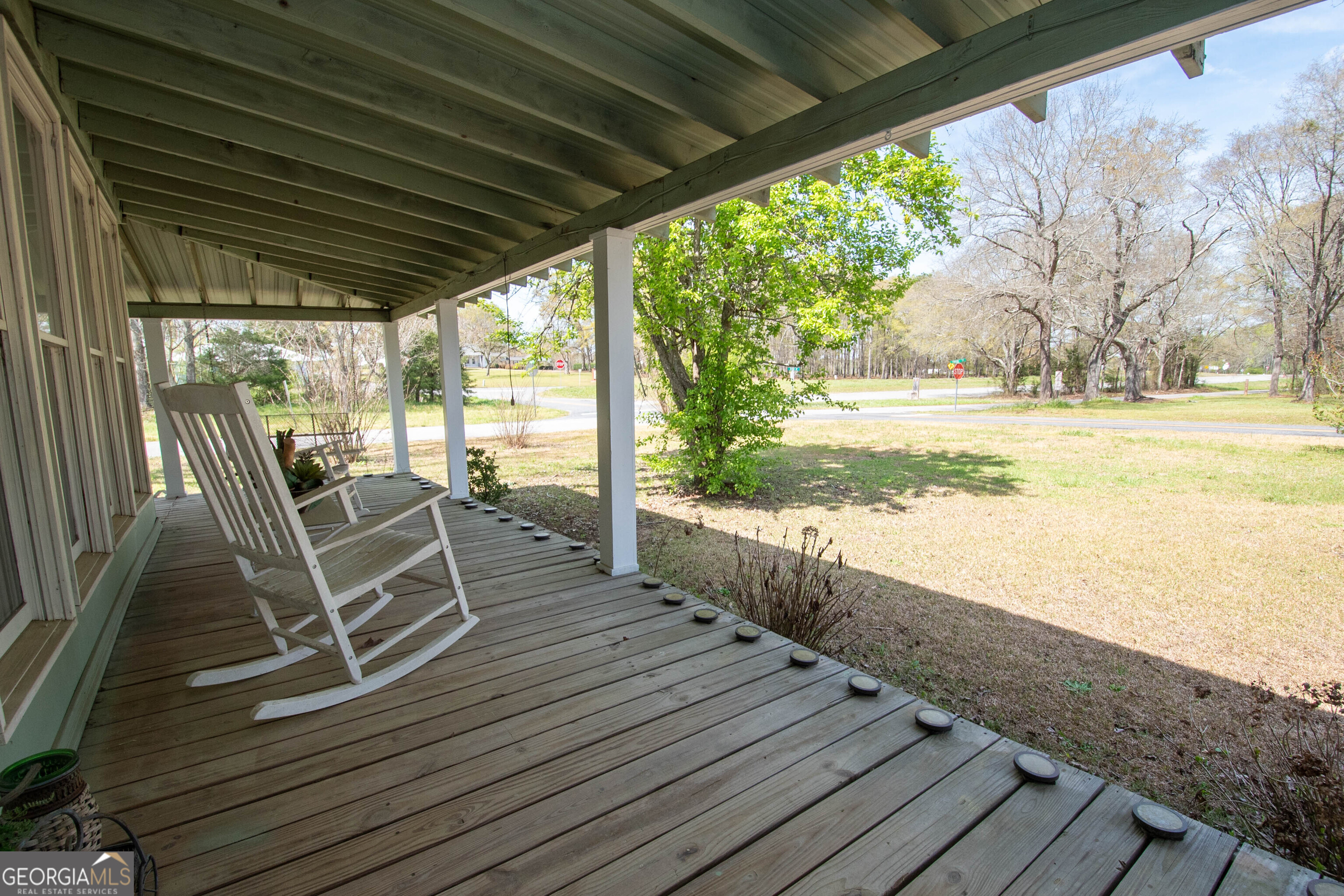 125 Fowler Street Warm Springs, GA 31830 - Photo 8 of 46 a view of a deck with wooden floor and outdoor space