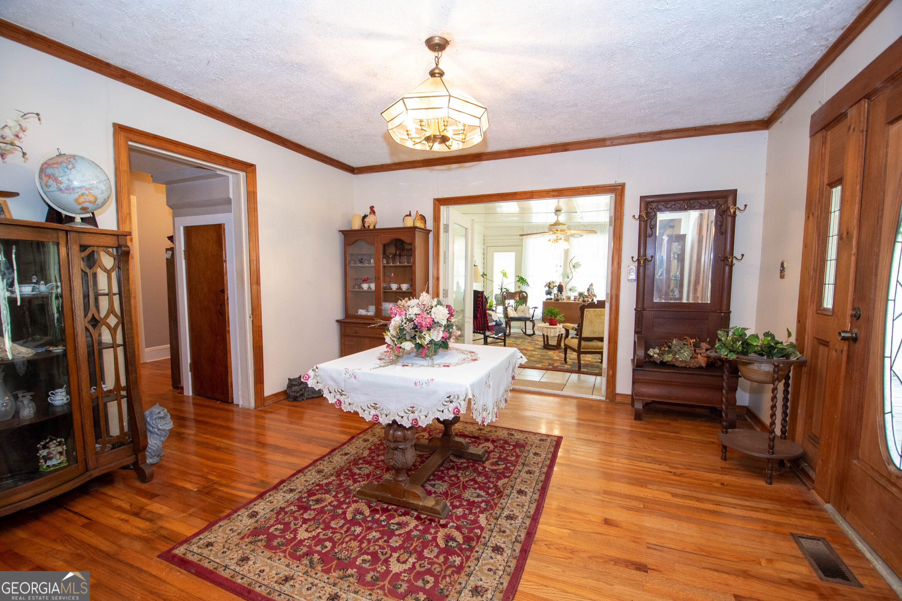125 Fowler Street Warm Springs, GA 31830 - Photo 9 of 46 a very nice looking room with a large window and a chandelier