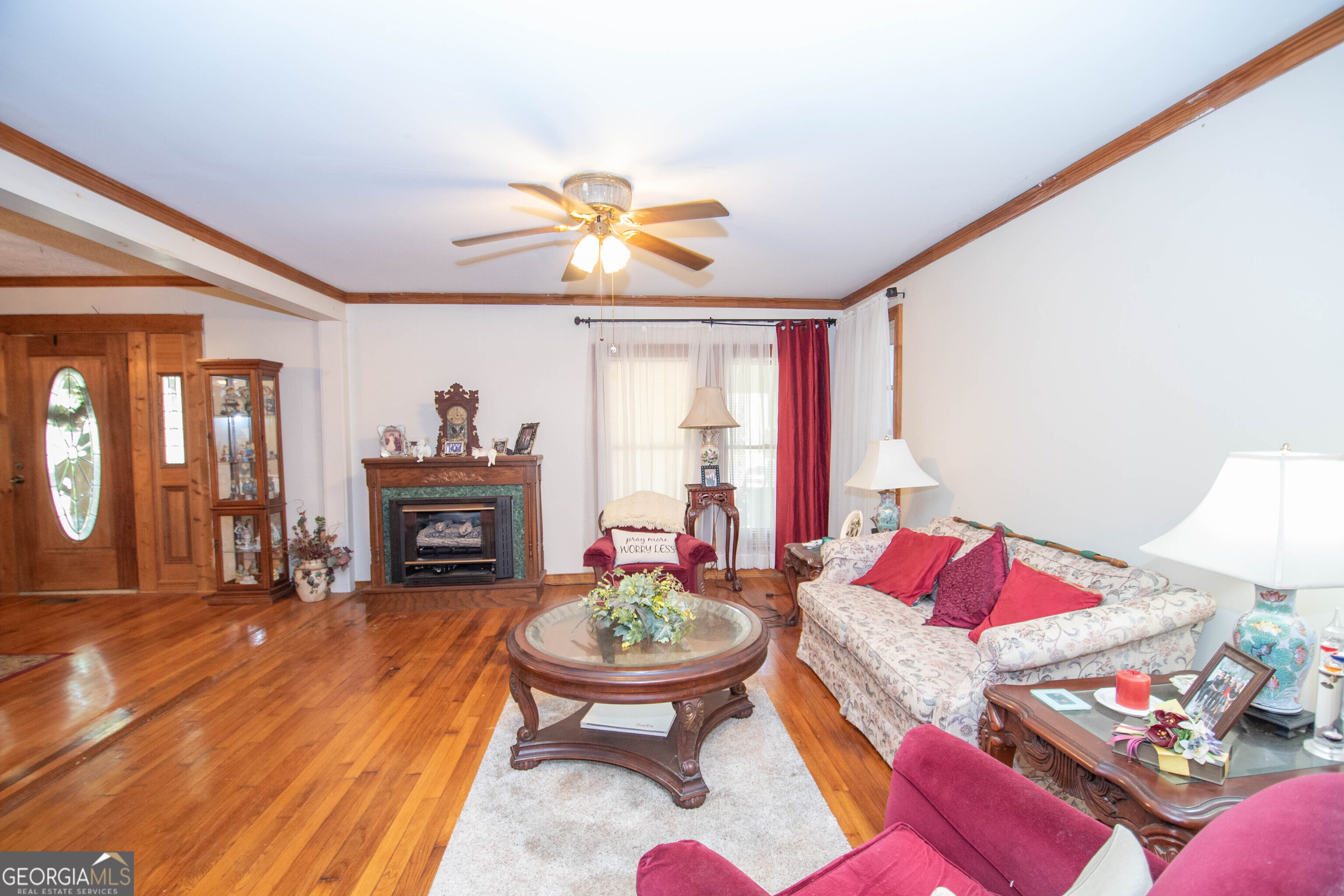 125 Fowler Street Warm Springs, GA 31830 - Photo 10 of 46 a living room with furniture and a fireplace