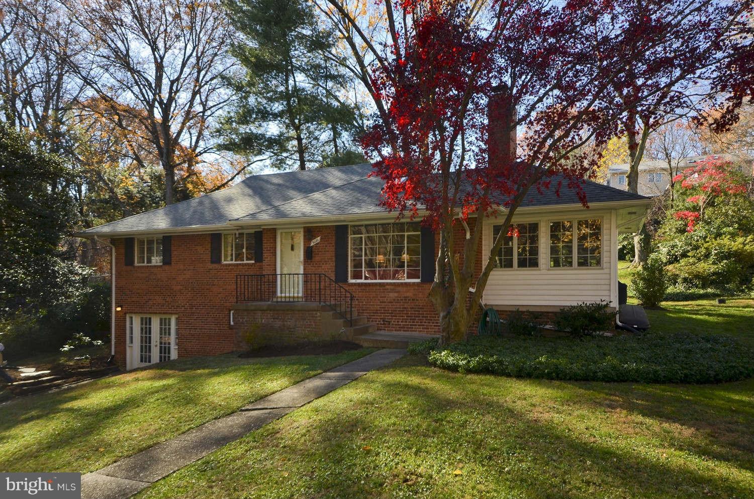 3020 Military Road Arlington, VA 22207 - Photo 1 of 26 a front view of a house with a garden