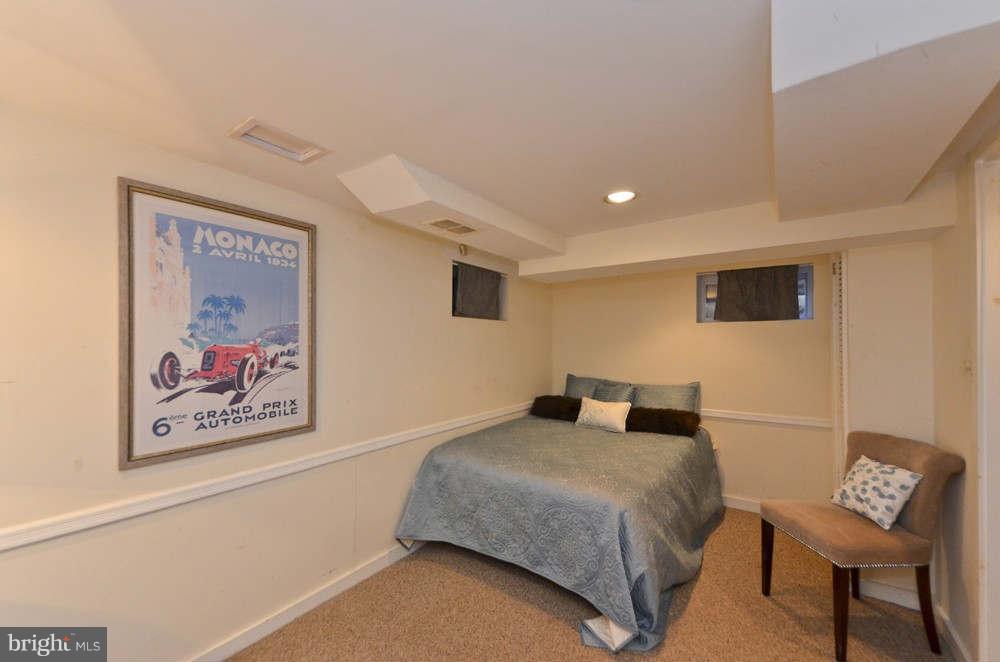 3020 Military Road Arlington, VA 22207 - Photo 15 of 26 a bedroom with a bed and a wall painting