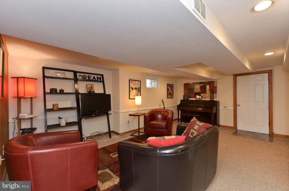 3020 Military Road Arlington, VA 22207 - Photo 18 of 26 a living room with furniture a flat screen tv and a window