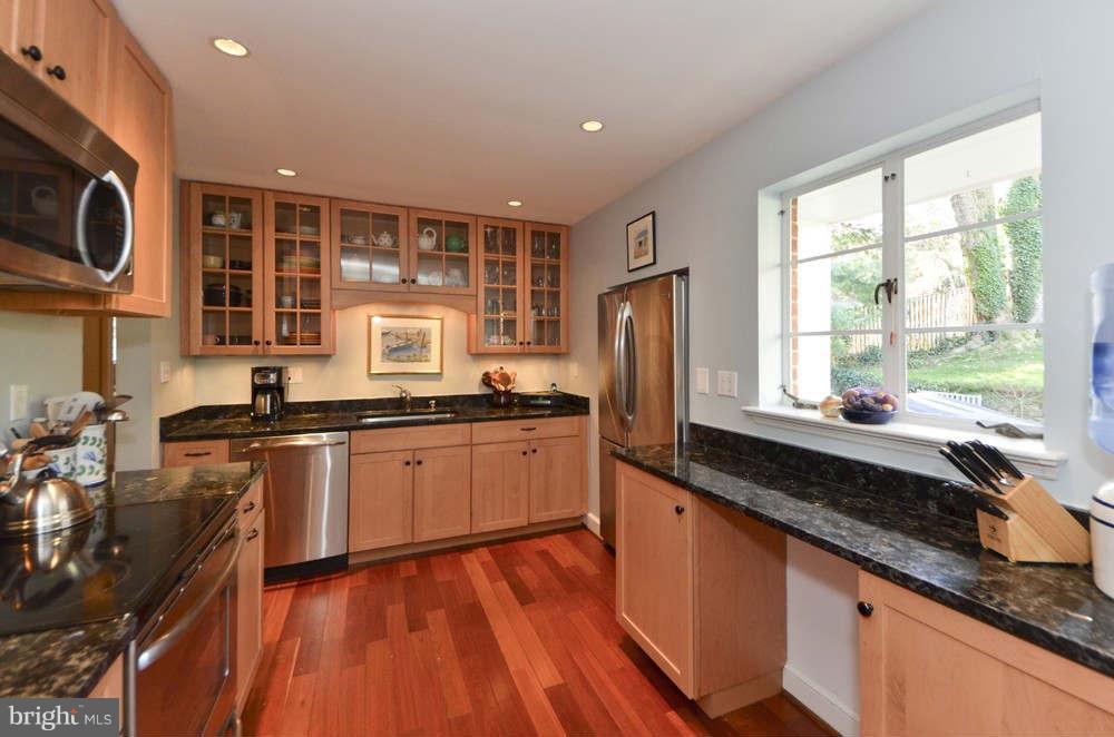 3020 Military Road Arlington, VA 22207 - Photo 8 of 26 a large kitchen with stainless steel appliances granite countertop a stove a sink and a refrigerator