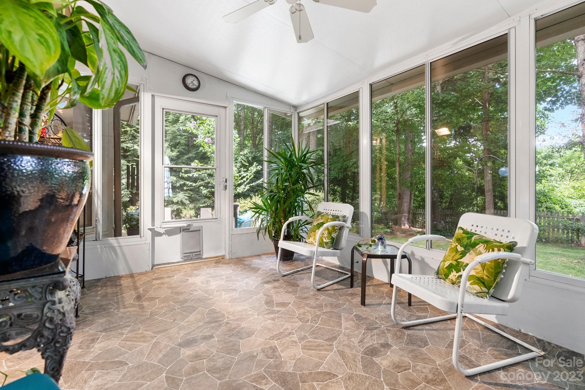 6 Holly Ridge Court Arden, NC 28704 - Photo 18 of 27 a living room filled with furniture and a large window