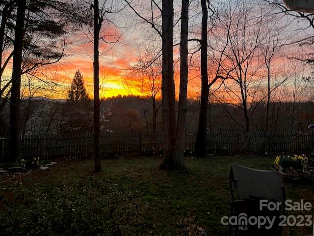 6 Holly Ridge Court Arden, NC 28704 - Photo 20 of 27 a backyard of a house with lots of green space and outdoor seating