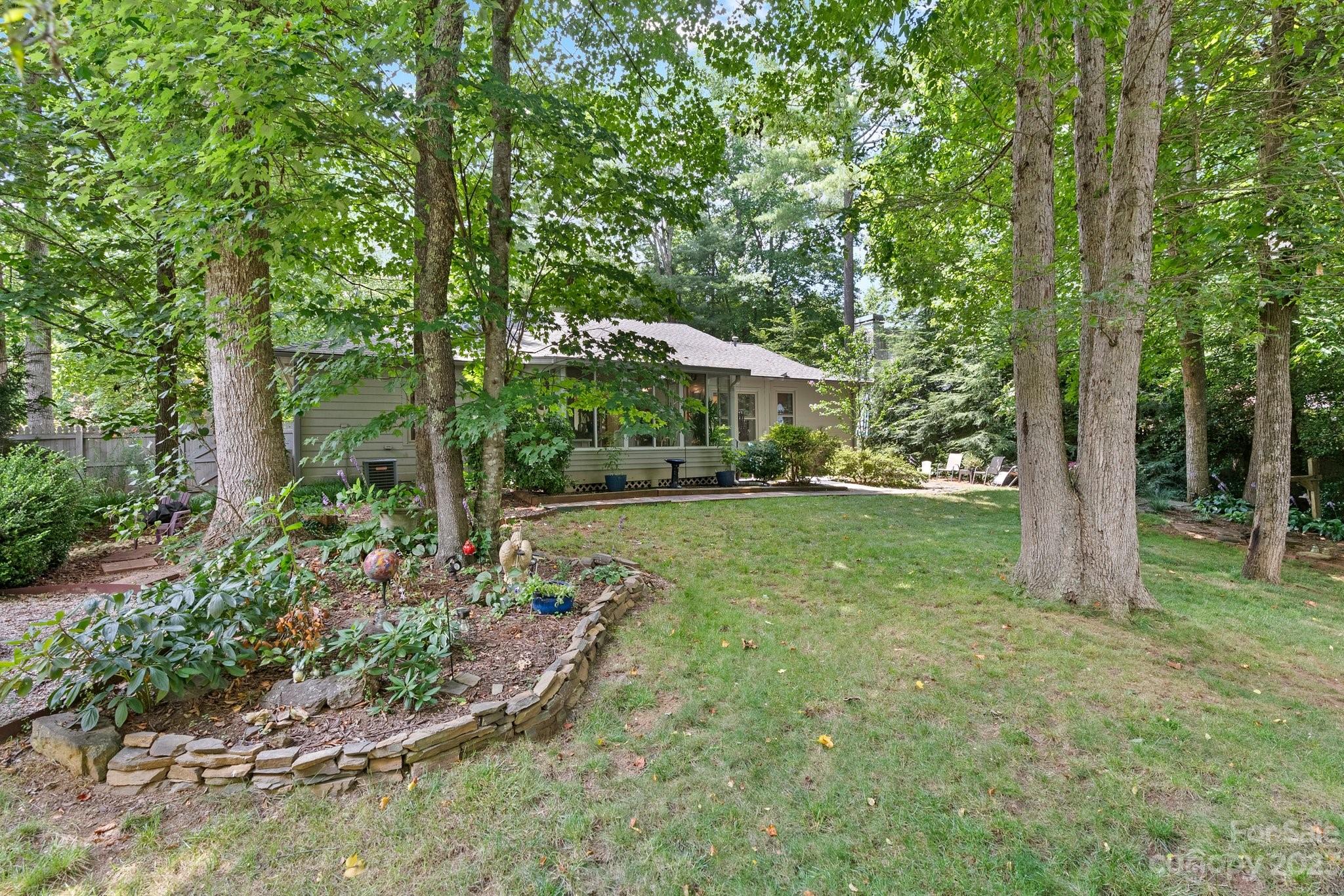 6 Holly Ridge Court Arden, NC 28704 - Photo 22 of 27 a view of a house with a yard