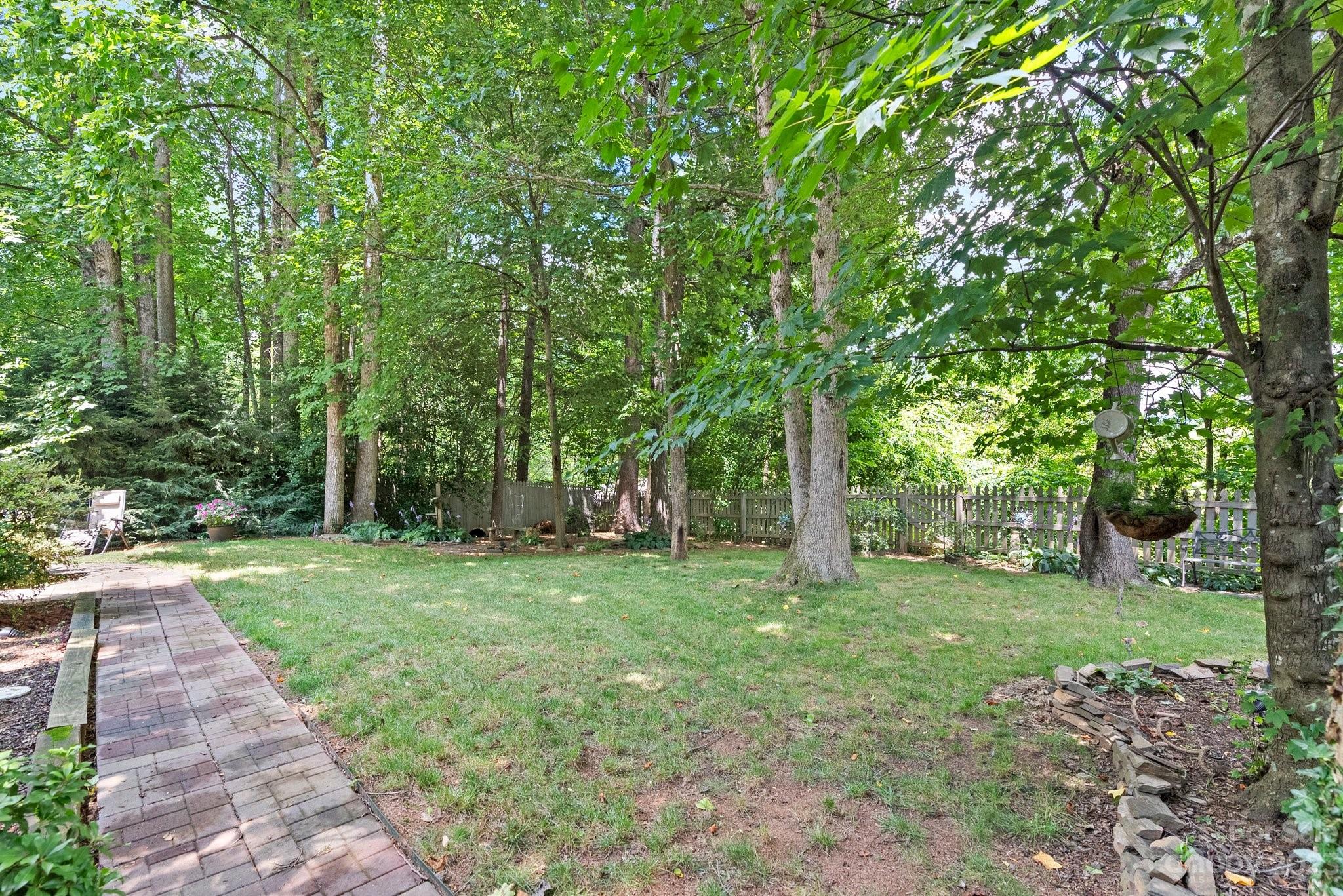 6 Holly Ridge Court Arden, NC 28704 - Photo 25 of 27 a view of a grassy field with trees