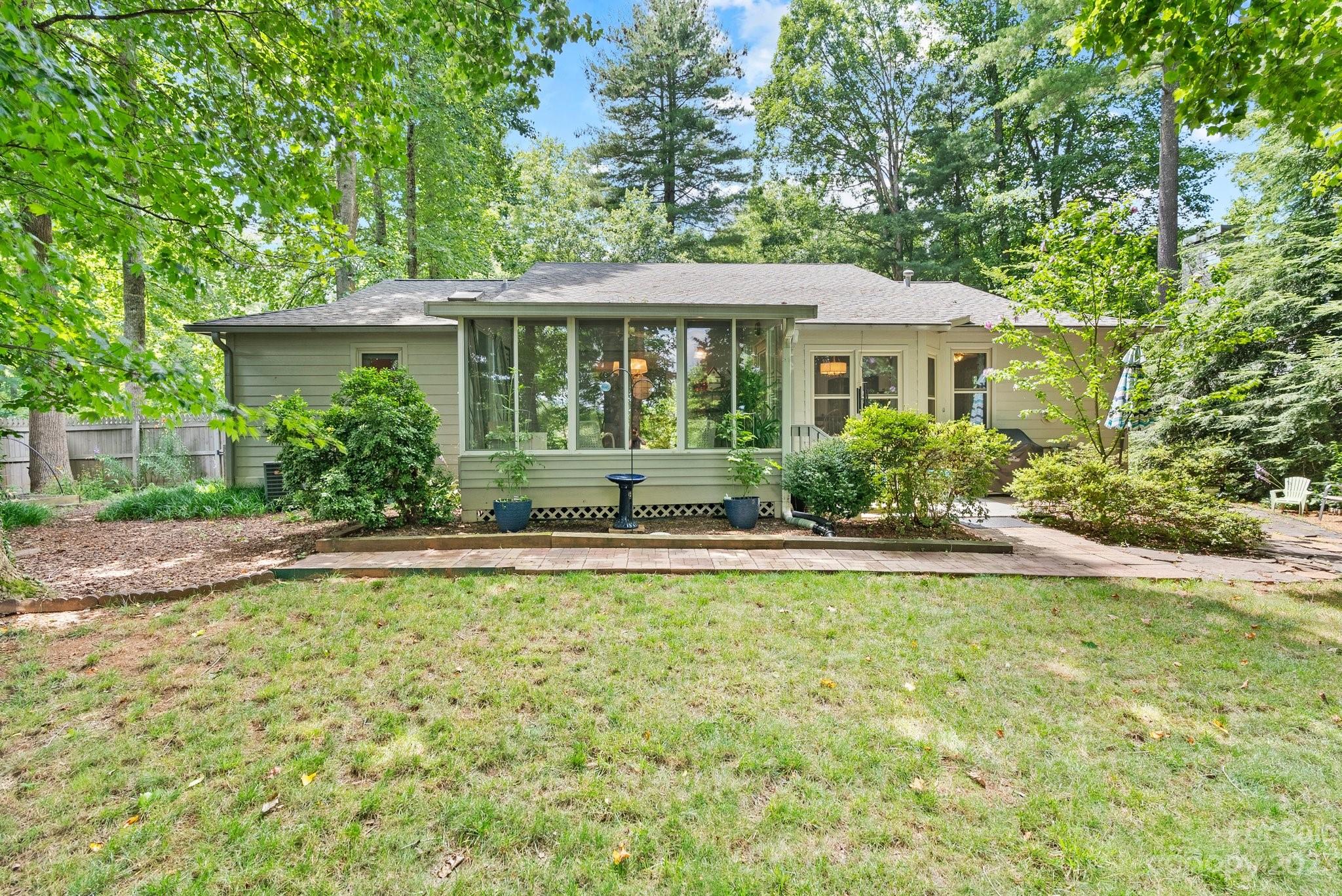 6 Holly Ridge Court Arden, NC 28704 - Photo 3 of 27 a front view of a house with a yard