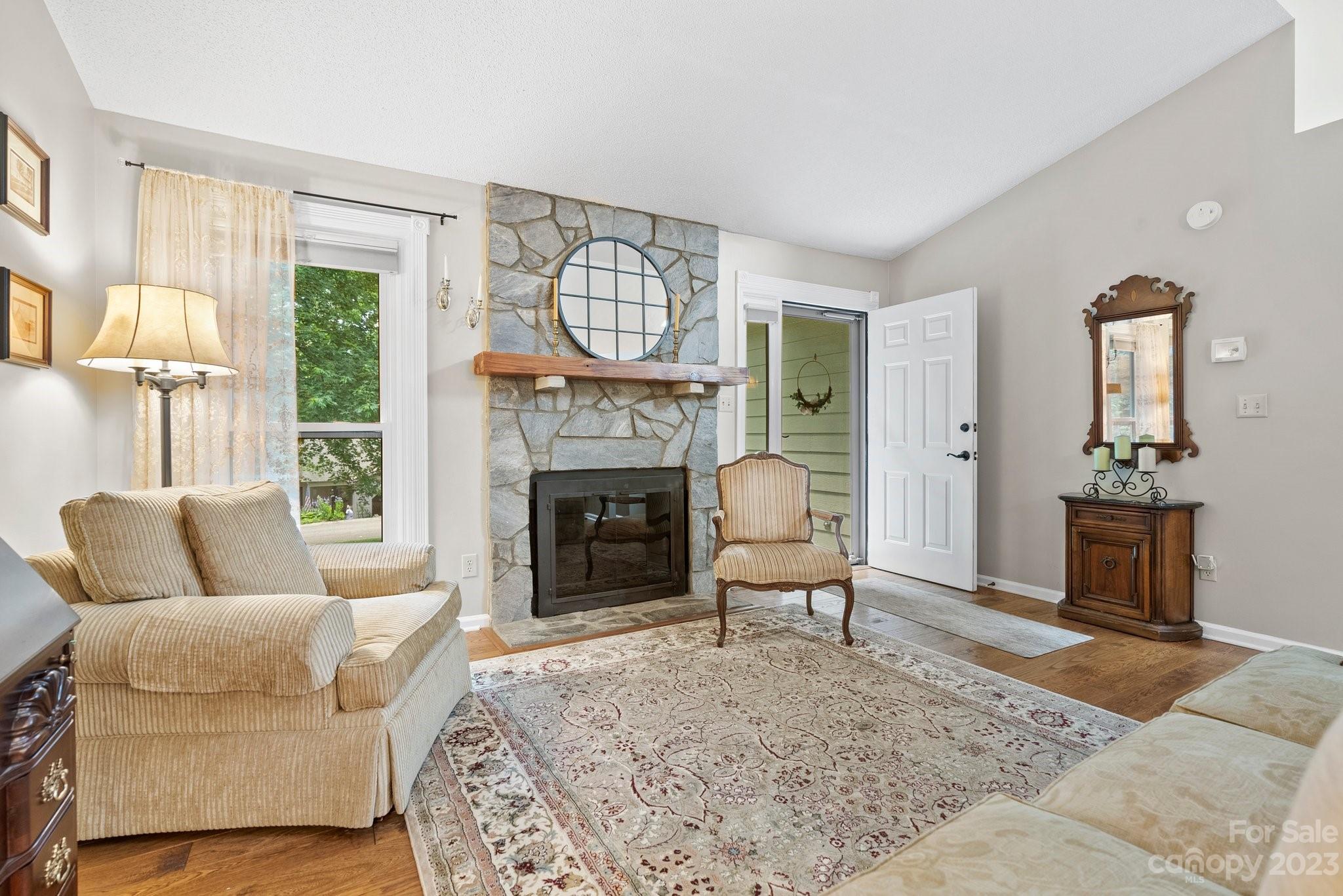 6 Holly Ridge Court Arden, NC 28704 - Photo 5 of 27 a living room with furniture and a fireplace