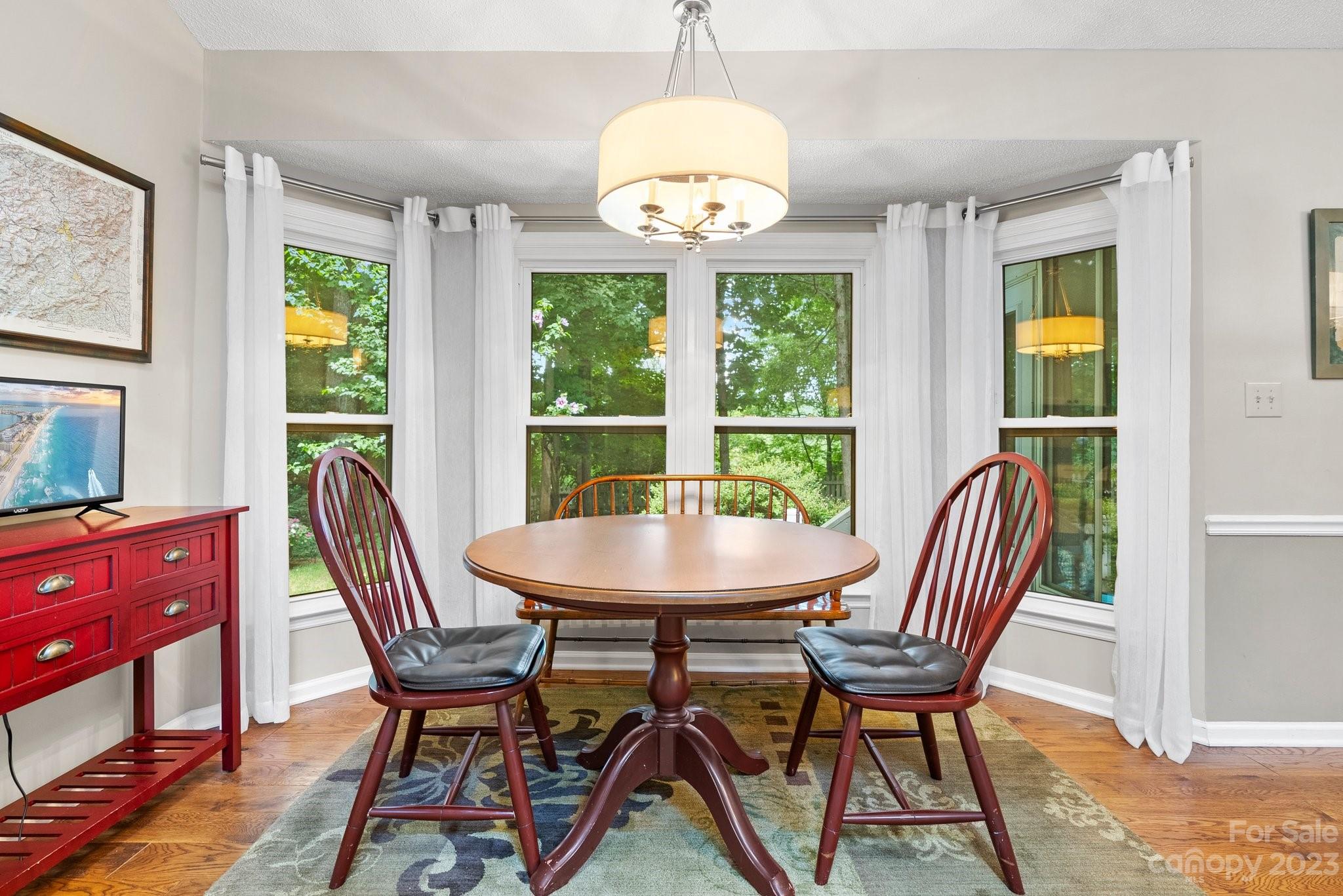 6 Holly Ridge Court Arden, NC 28704 - Photo 8 of 27 a view of a dining room with furniture and a window