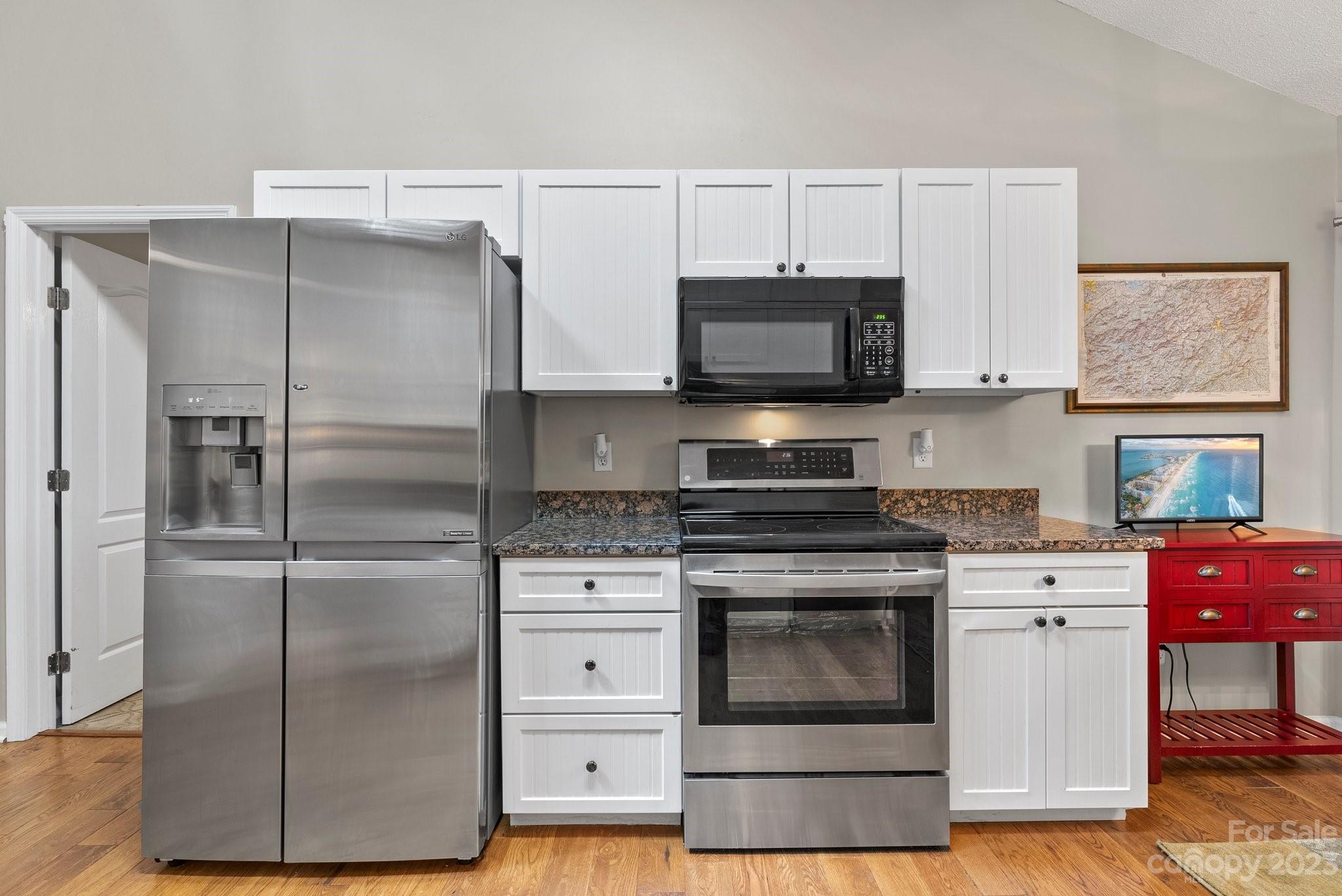 6 Holly Ridge Court Arden, NC 28704 - Photo 10 of 27 a kitchen with a refrigerator stove and microwave