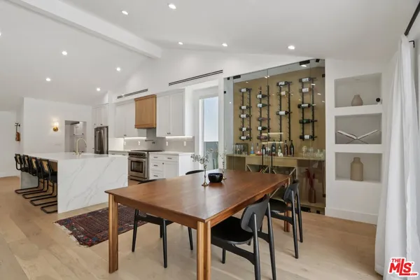 a view of a dining room with furniture and window