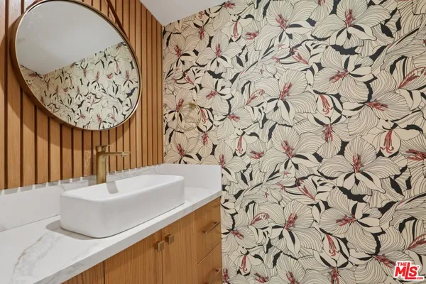 a bathroom with a sink and a mirror