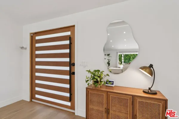 a view of entryway with wooden floor