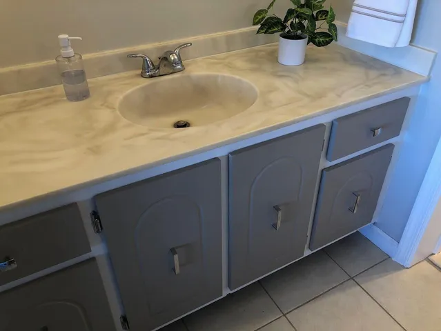 a bedroom with a bed and a cabinets