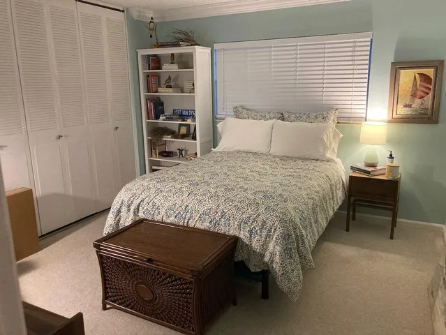 a view of a swimming pool with outdoor seating