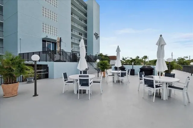 a view of a lake with a sitting space and a table