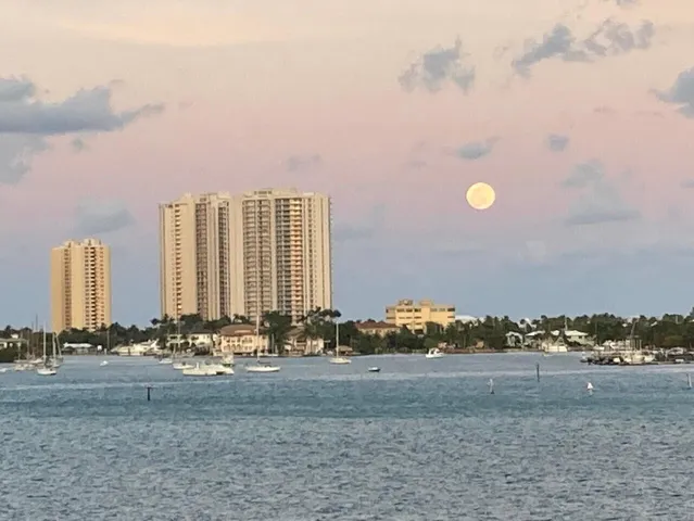 a view of a lake and outdoor seating