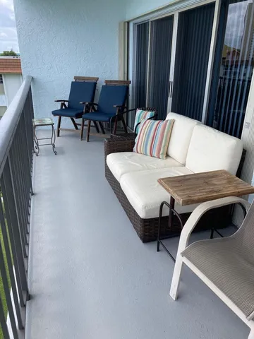 a kitchen with white cabinets and a stove