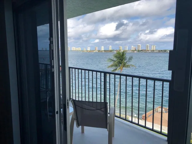 a kitchen with stainless steel appliances granite countertop a sink and a stove