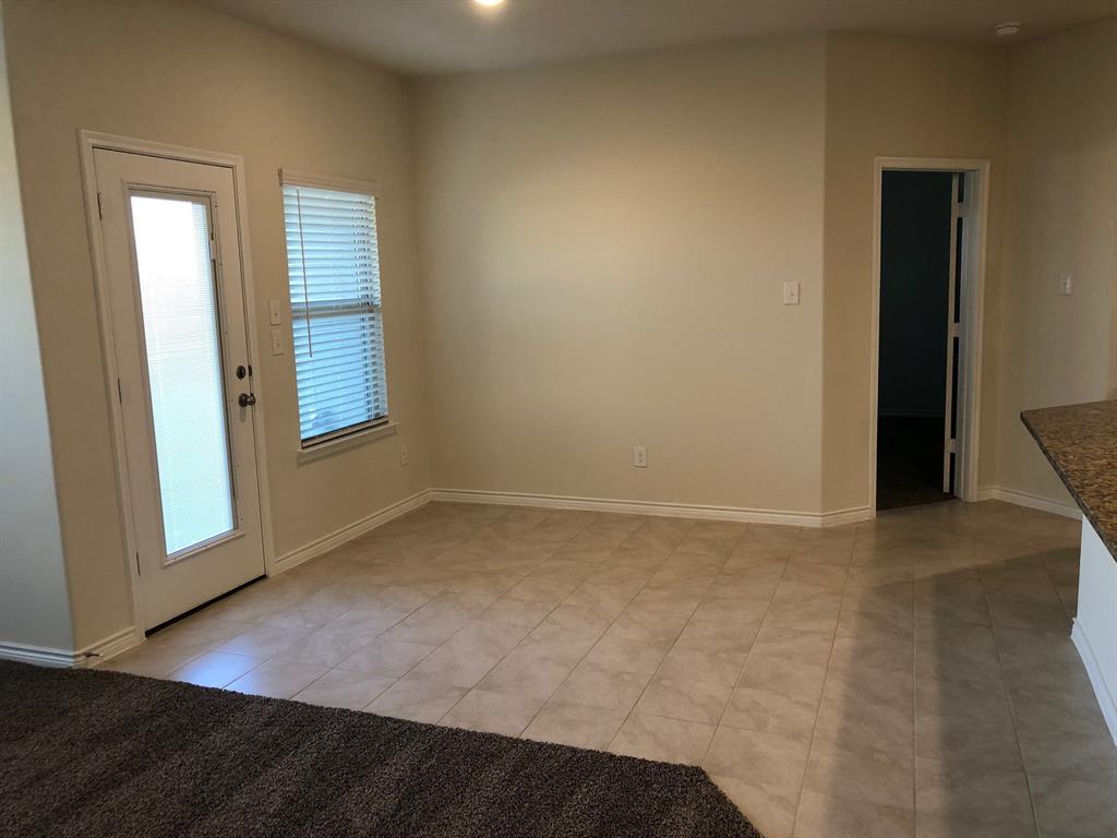 1732 Beasley Street Van Alstyne, TX 75495 - Photo 3 of 17 Empty room with light tile patterned flooring and baseboards