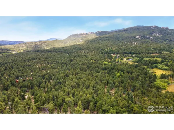 a open area with mountains in the background