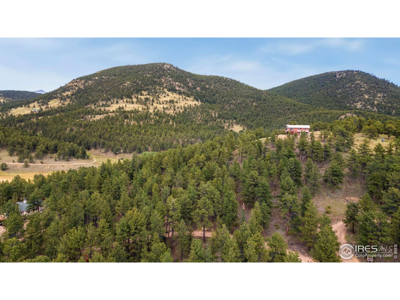 357 Big John Road Lyons, CO 80540 - Photo 4 of 14 a black and white photo of a mountain