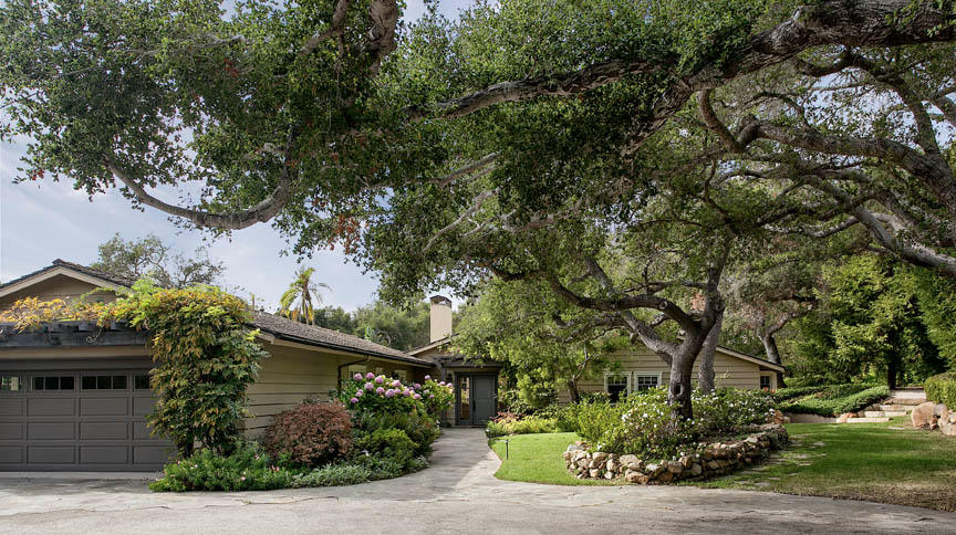 a view of house with a tree in the background