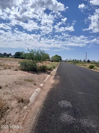 a view of a lake with beach and city view