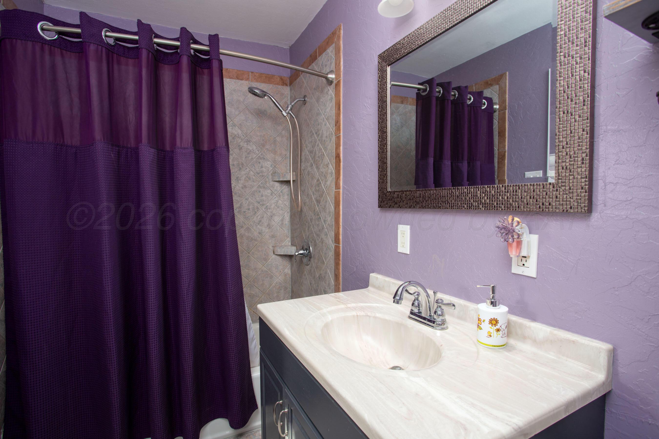 5206 George Terrace Amarillo, TX 79106 - Photo 12 of 24 a bathroom with a sink vanity and a mirror