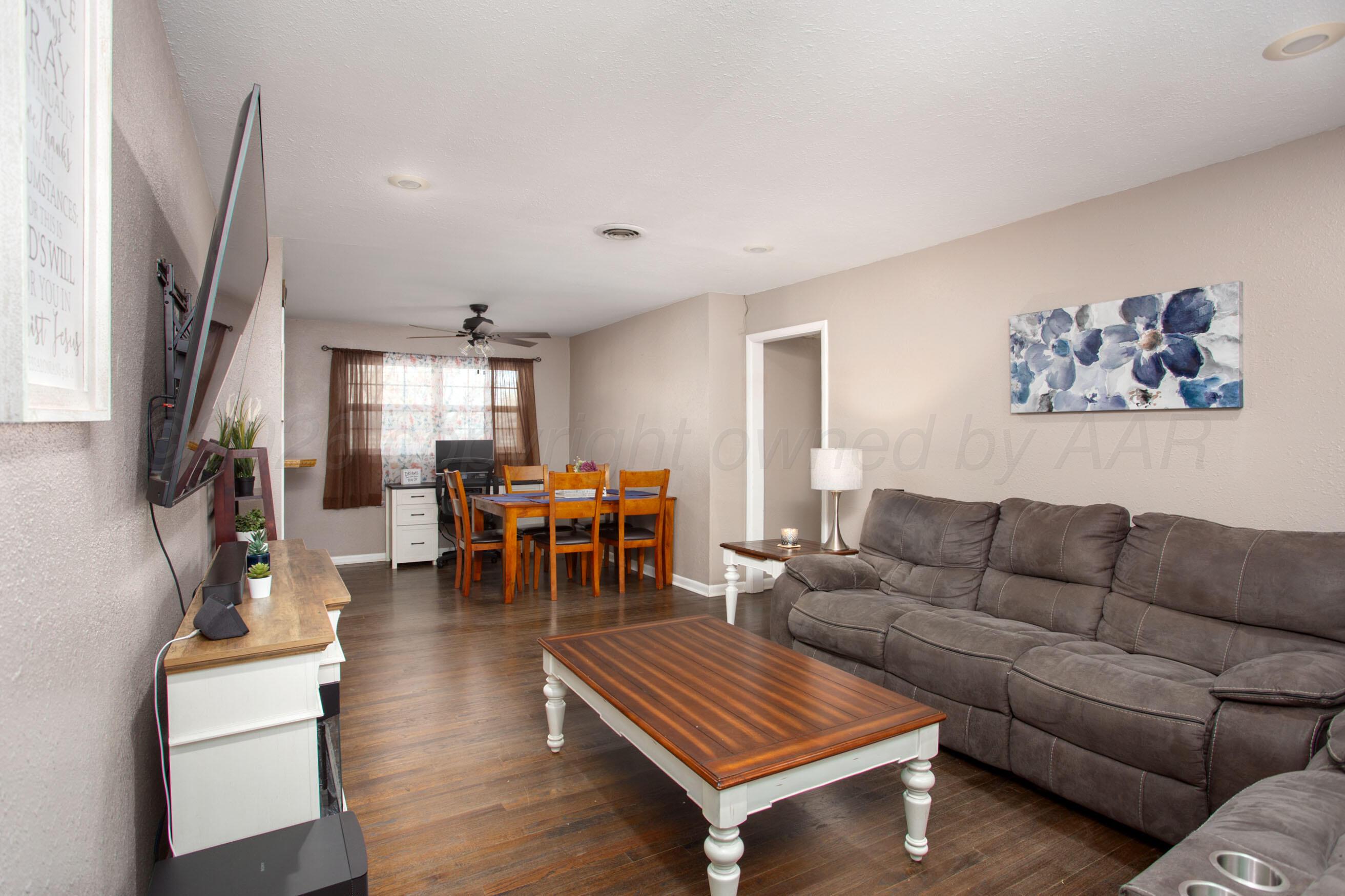 5206 George Terrace Amarillo, TX 79106 - Photo 3 of 24 a living room with furniture and a chandelier