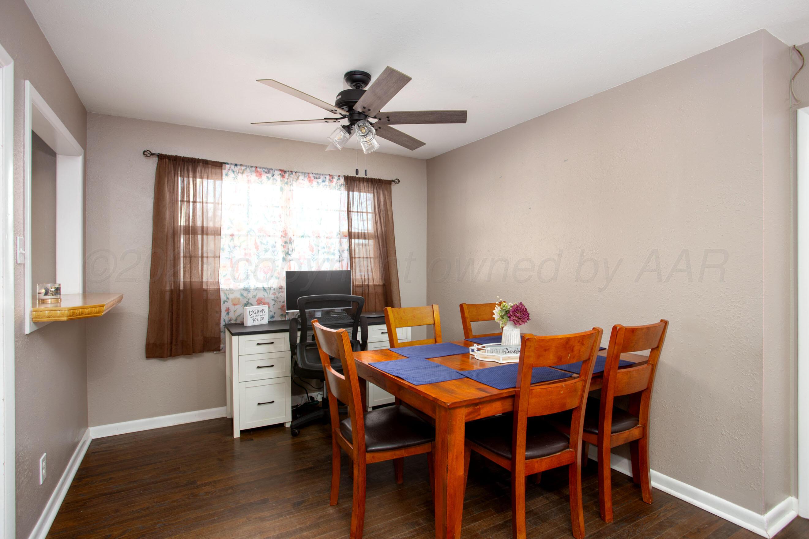 5206 George Terrace Amarillo, TX 79106 - Photo 4 of 24 a view of a dining room with furniture window and wooden floor