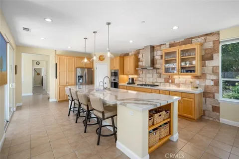 a kitchen with a stove and a refrigerator