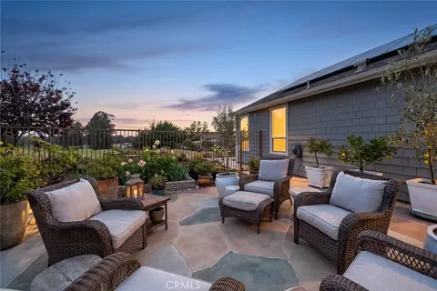 a outdoor living space with furniture and a potted plant