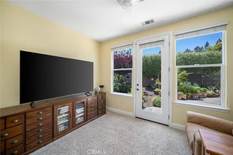 a bedroom with a large bed and a window