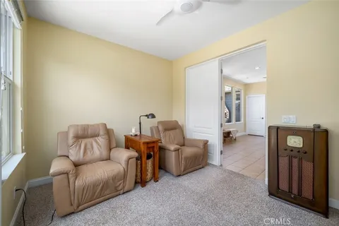 a balcony with furniture and a fireplace