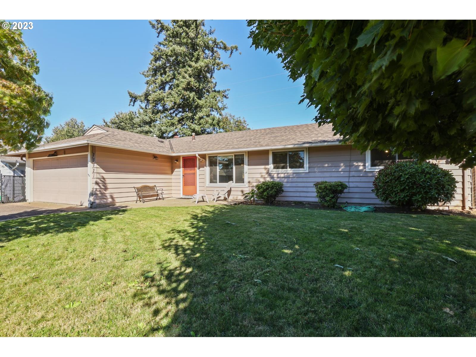 a view of a house with a backyard